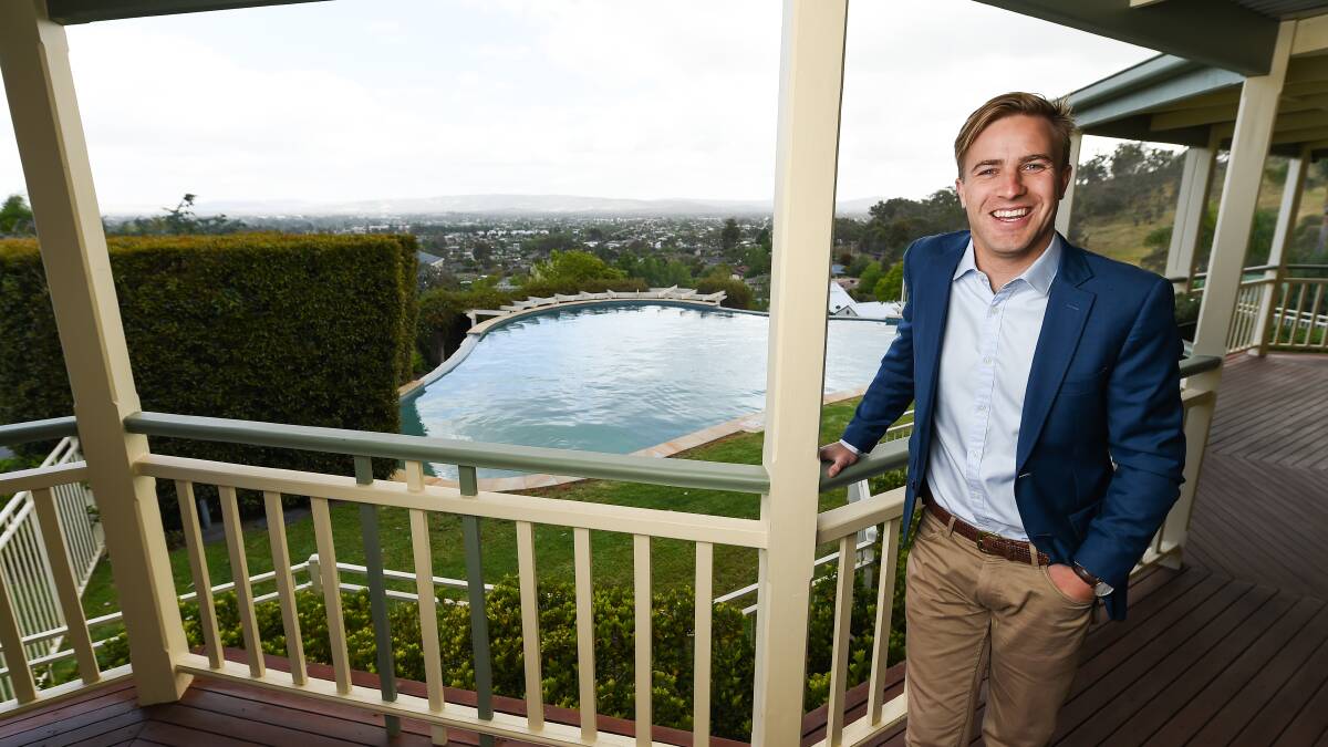UP FOR GRABS: Stean Nicholls agent Jack Stean at the Caernarvon Court property in Wodonga to be auctioned tomorrow. Picture: MARK JESSER