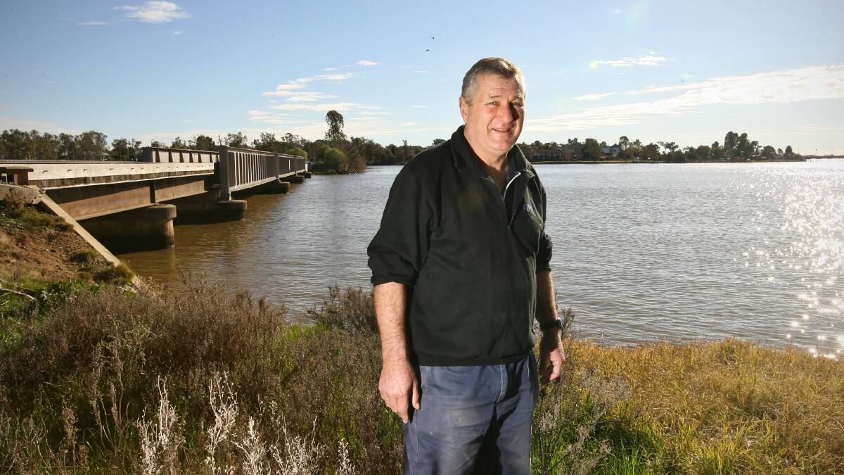 John Lawless in front of the green route alignment option across Lake Mulwala.