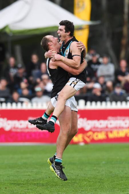 JUMPING FOR JOY: Panther pair Shaun Mannagh and Aidan Johnson celebrate a last quarter goal in the grand final. Picture: MARK JESSER
