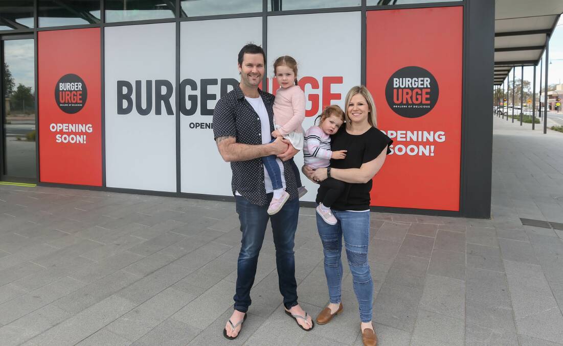 BACK IN TOWN: Greg and Nicole Dean, pictured with daughters, Willow, 3 and Harper, 2, will operate Burger Urge on the High Street-Elgin Boulevard corner. Picture: TARA TREWHELLA