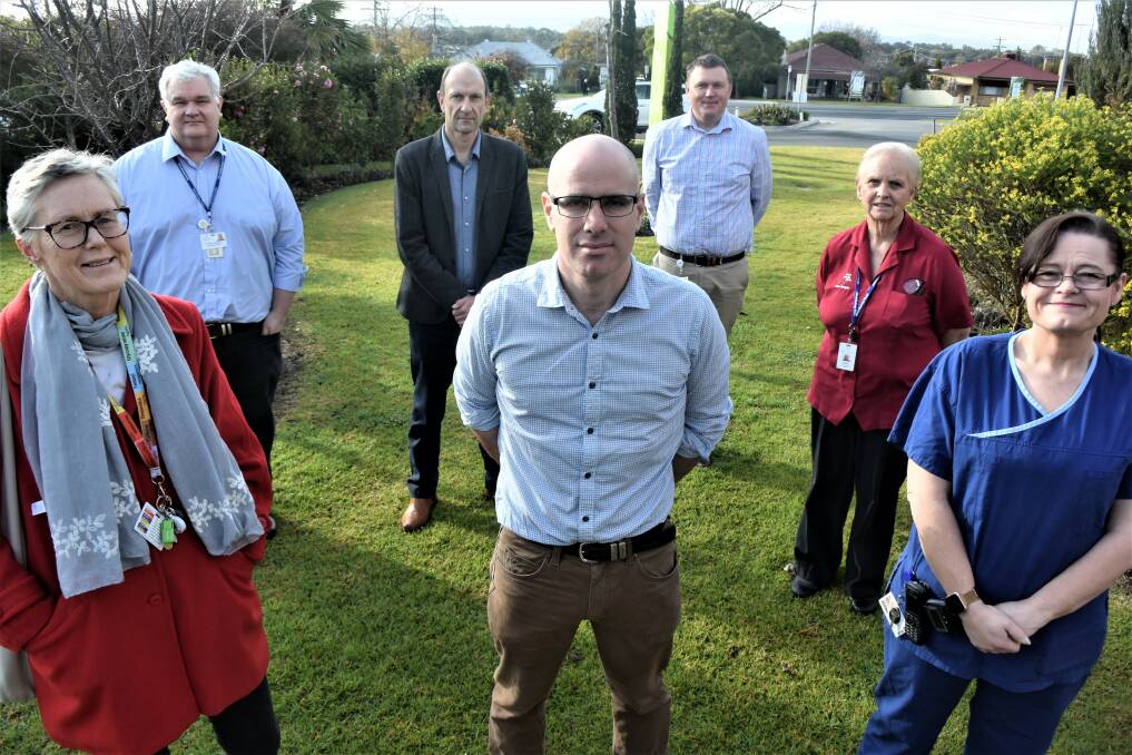 ON SAME PAGE: Albury-Wodonga clinicians, front, Barb Robertson, David Clancy, Kim Cole, back, David Rutherford, Heinrich Schwalb, Jim Robertson and Helen McKee.