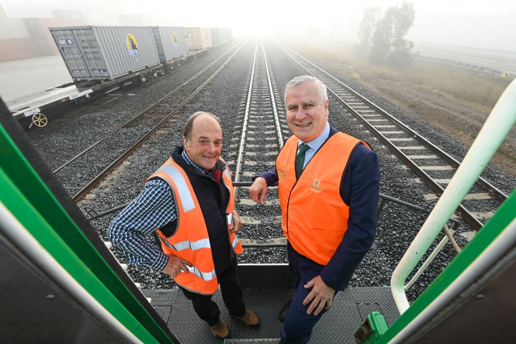 Ettamogah rail hub founder Colin Rees, left, and Acting Prime Minister Michael McCormack. Picture: MARK JESSER