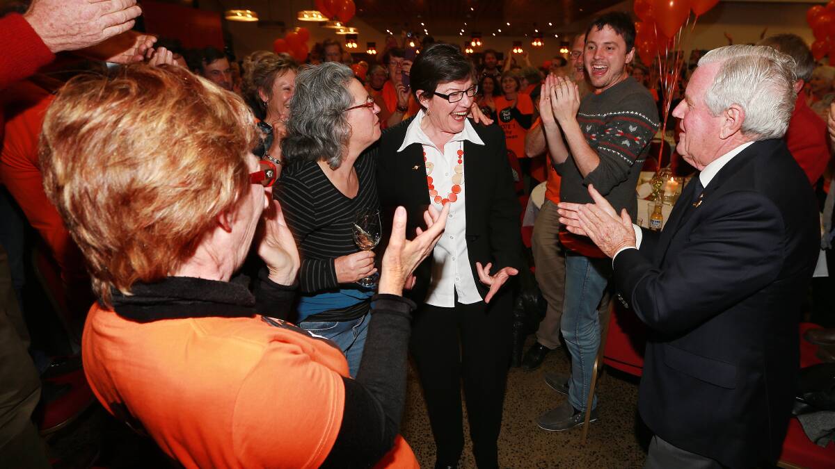 INDI COUP: Cathy McGowan is congratulated on her 2013 election win by supporters including Ken Jasper.