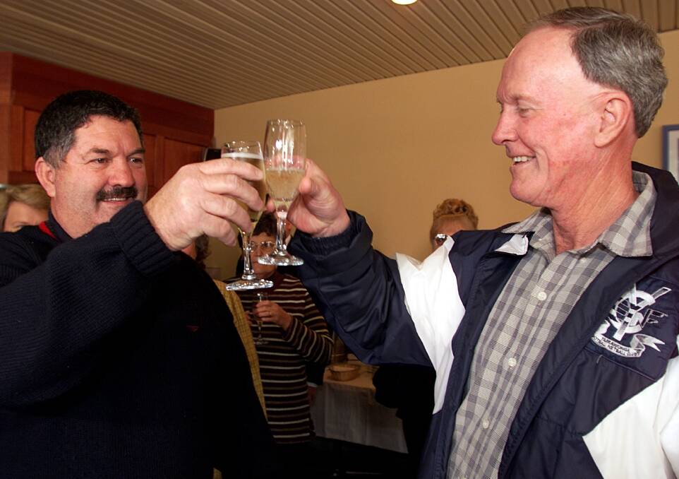 MISSION ACCOMPLISHED: Robert Purtle, left, and the late Neil Davis celebrate the federal government's decision to retain the Mulwala ADI munitions plant in 2001.