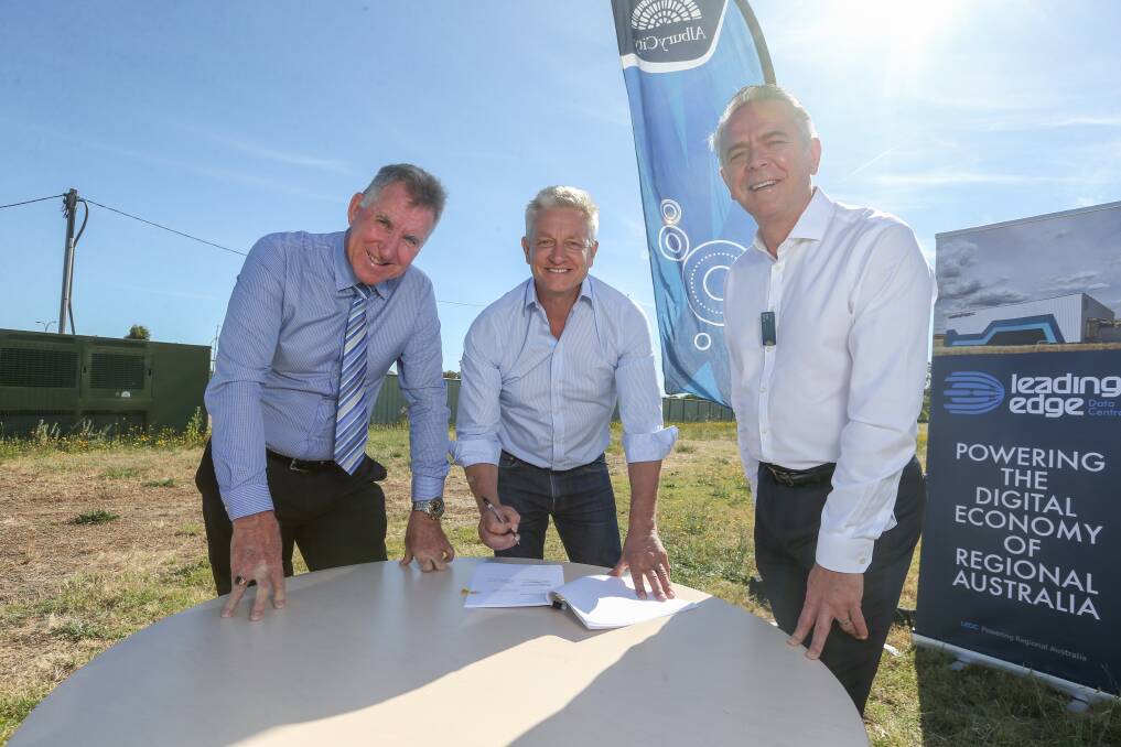 DIGITAL BOOST: Tech company Leading Edge founder Chris Thorpe, centre, discusses plans for the Albury data centre with mayor Kevin Mack and council chief executive Frank Zaknich. Picture: TARA TREWHELLA