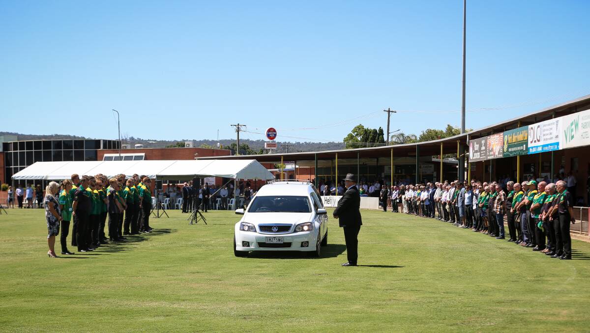 MARK OF RESPECT: A large guard of honour formed to farewell North Albury great Peter Westland at Bunton Park yesterday following his recent death. Picture: JAMES WILTSHIRE