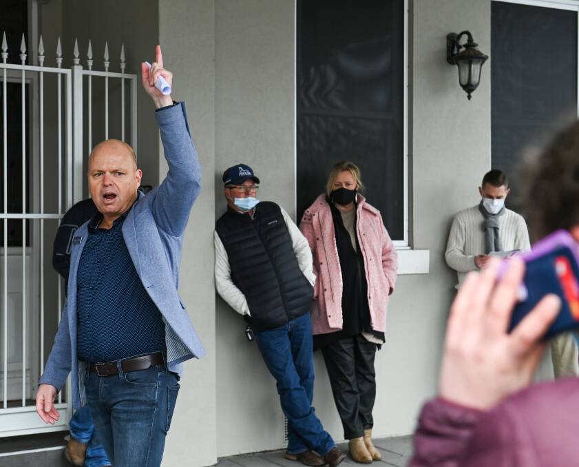 SUCCESSFUL SALE: PJ Murphy Real Estate agent James Seymour during the auction for the Smollett Street townhouse which later sold for $835,000. Picture: MARK JESSER