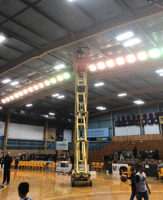 RUNNING REPAIRS: A scissor lift was swung into action to fix leaking roof at Lauren Jackson Sports Centre during Bandits basketball double-header on Saturday.