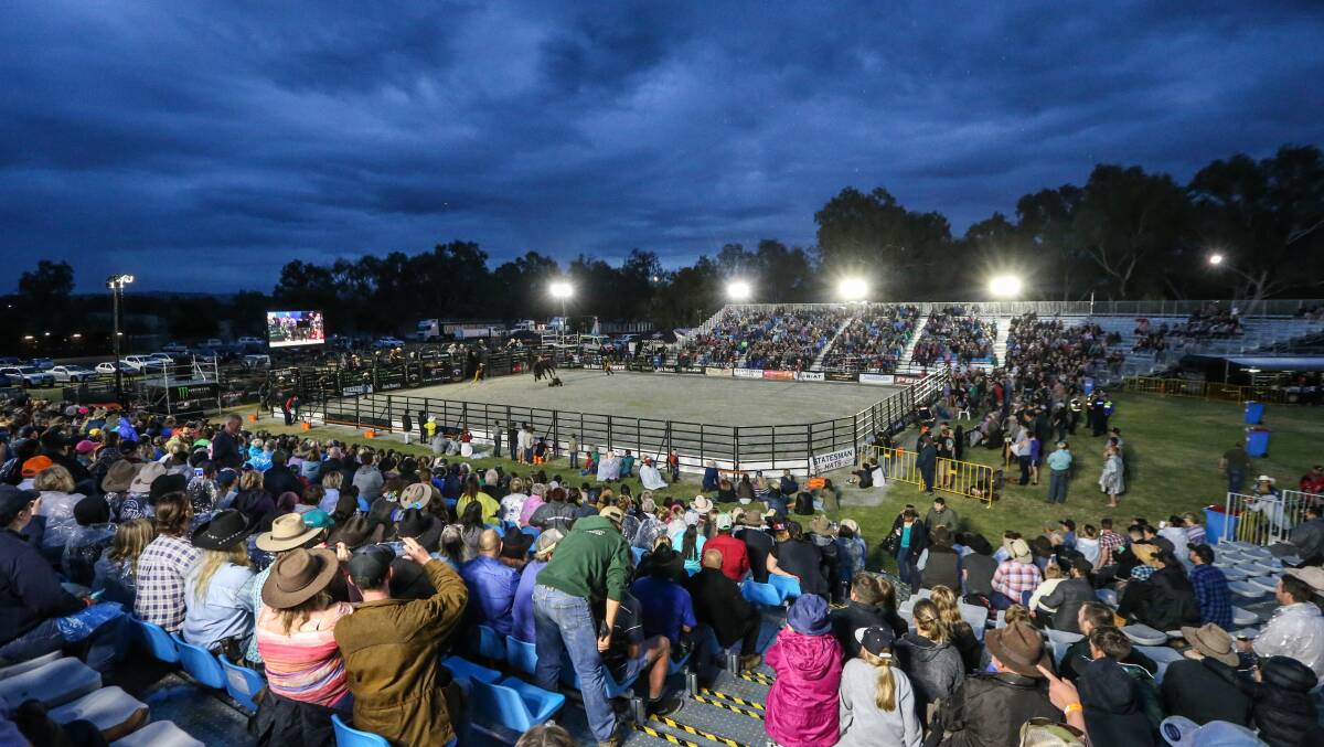 The professional bull riding event in Wodonga went ahead under threatening skies. Picture JAMES WILTSHIRE