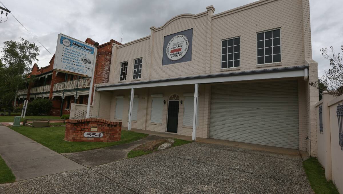 KNOCK BACK: Plans to convert a former garage into shops, serviced apartments and a manager's residence has been torpedoed by a majority of Albury councillors. Picture: TARA TREWHELLA