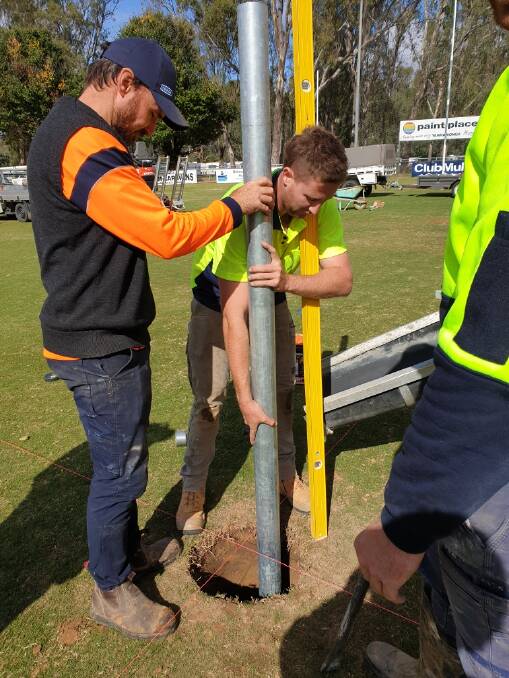 WORKING BEE: Rugby league goal posts were being erected at Yarrawonga for Melbourne Storm late last week.