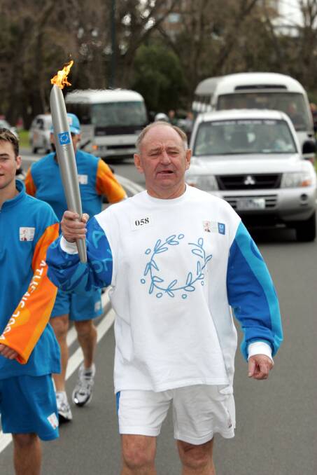 FLASHBACK: Ray Thomas was chosen to carry the Olympic torch in 2004. His funeral will be held on Thursday.