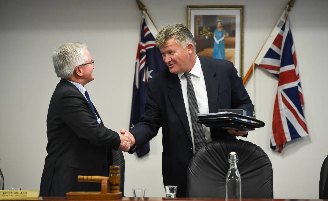 WELCOME ABOARD: Federation Council mayor Pat Bourke, right, is congratulated by general manager Chris Gillard on his election to the top job on Tuesday. Picture: MARK JESSER