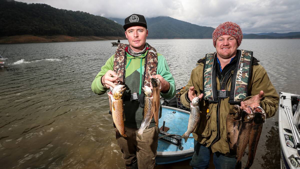 BACK IN GAME: Luke Welsh, left, and Pete Paton with trout they caught in the Dartmouth Cup. Picture: JAMES WILTSHIRE