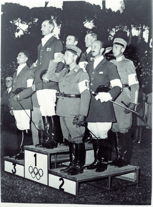 The Australian three-day event team of Bill Roycroft, Neale Lavis and Laurie Morgan at the medal ceremony after beating Switzerland and France for gold.