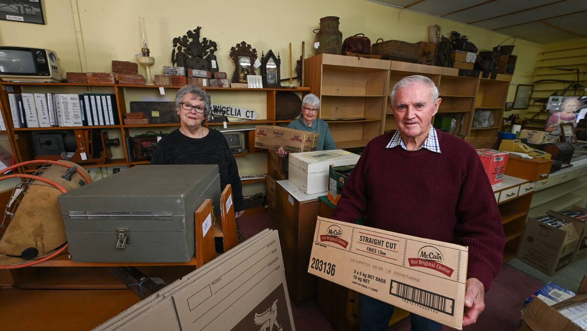 ON THE MOVE: Wodonga Historical Society committee members, from left, Uta Wiltshire, Marie Elliot and John Flower have commenced packing up their South Street home of 20 years. Picture: MARK JESSER