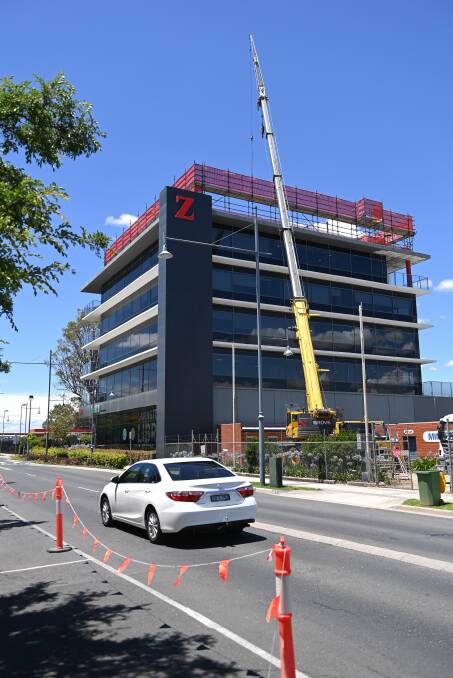 ONLY WAY IS UP: Northpoint Tower in Griffith Road, Lavington is expanding to a sixth level with the project well underway. Picture: MARK JESSER