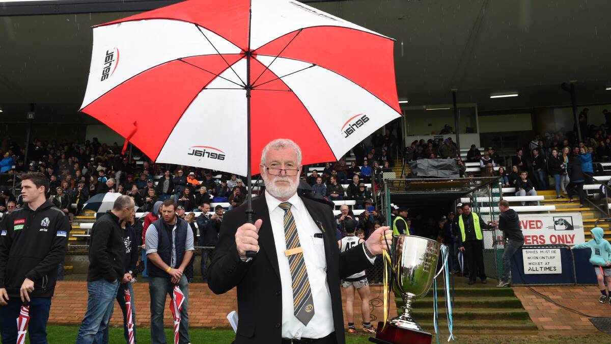 Ovens and Murray Football-Netball League chairman Graeme Patterson with the premiership cup before the grand final.