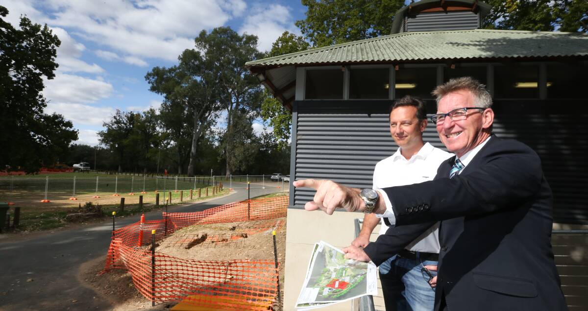 PLAN EXECUTED: Riverside Cafe owner Alex Smit and Albury mayor Kevin Mack assess the works underway in Noreuil Park. Picture: KYLIE ESLER