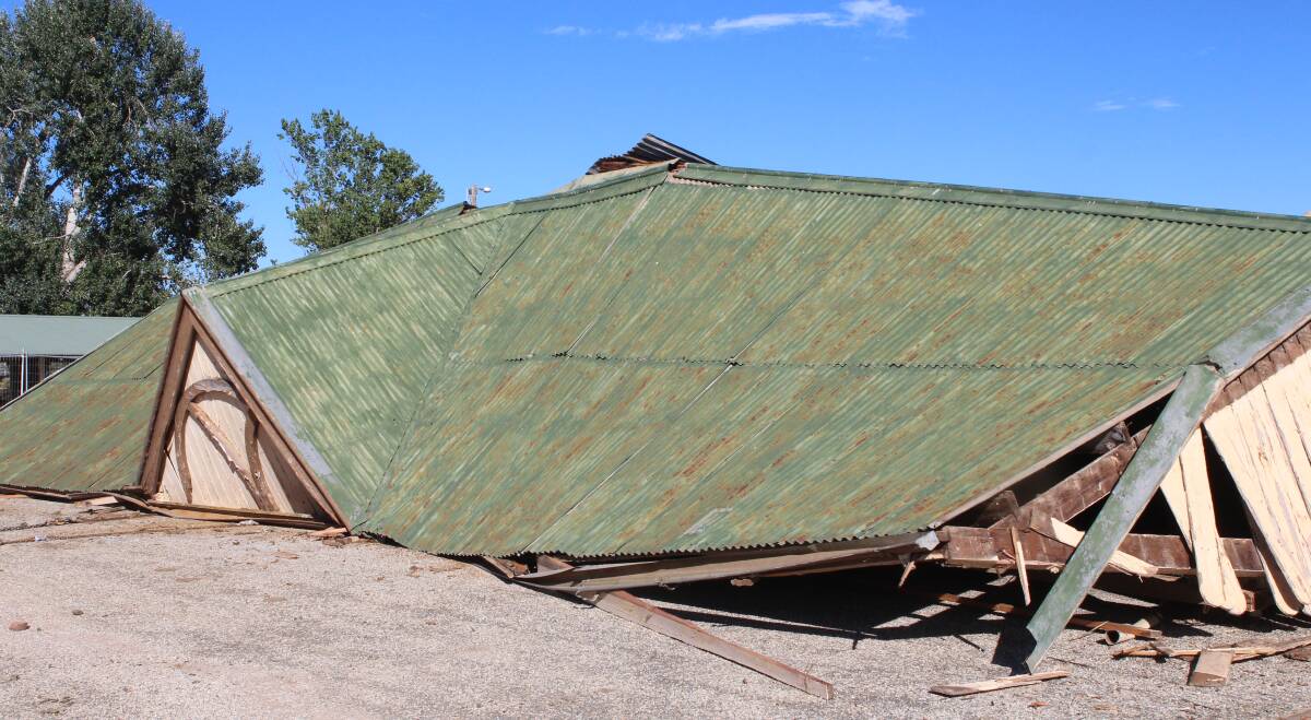 END OF AN ERA: The Corryong grandstand was brought to the ground by demolition contractors on Friday morning. Picture: MARK COLLINS