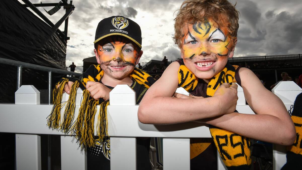 TIGER TIME: Jake and Sam Briggs from Glenrowan left no one in any doubt which team they followed on Saturday. Picture: MARK JESSER
