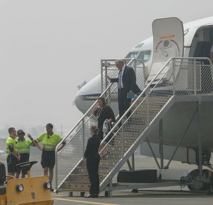 TOUCH DOWN: Prime Minister Scott Morrison and wife Jenny arrive at Albury Airport yesterday. Picture: TARA TREWHELLA