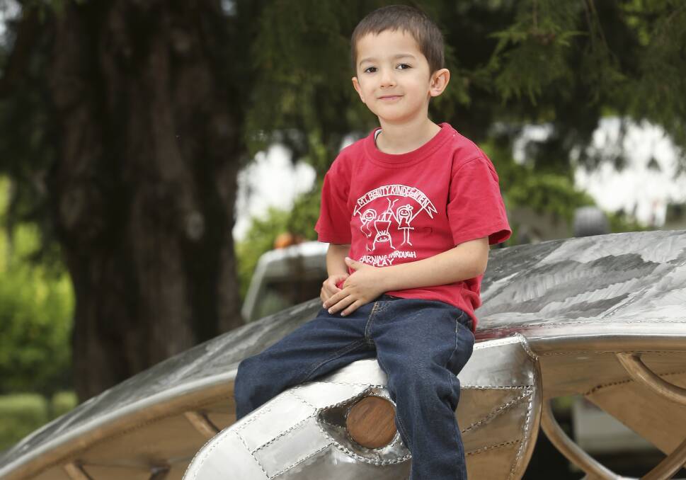 NEW PASSENGER: James Wilkinson, 5, of Mount Beauty sits on top of the new sculpture, which was unveiled at the Park Street Reserve playground on Friday. 