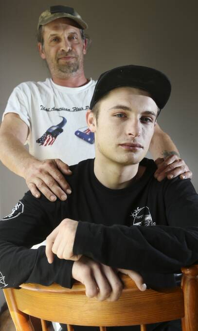 ONE PUNCH: Chris Callesen with his son Michael, 19, of Thurgoona who has stitches in his mouth after he was hit at a party in Lavington. Picture: ELENOR TEDENBORG