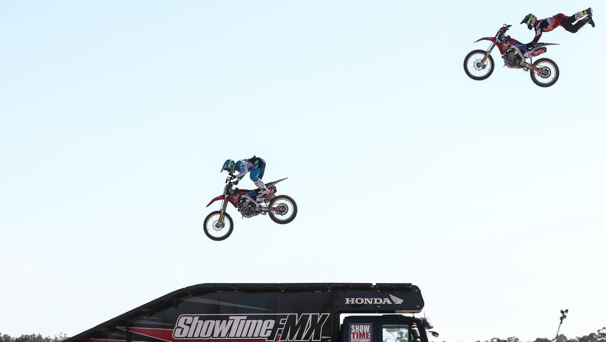 FLYING HIGH: A dirt bike routine competed with the AFL grand final and bull ride for spectators on Saturday afternoon who witnessed nail biting stunts.