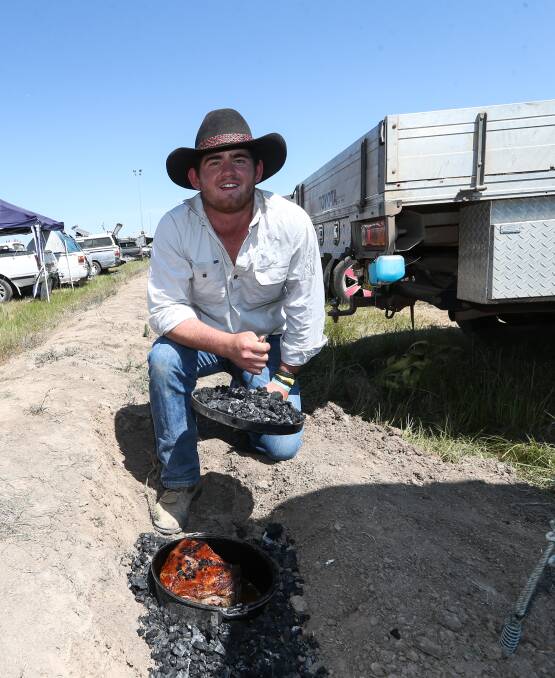 A HEARTY FEED: Greg Staines, from Leeton, offered up a serving of roast lamb and gravy for lunch which was cooked in the hot coals at his camp site. 