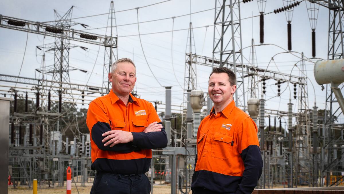 POWER HOUSE:  Essential Energy employees Cameron Creek and Stuart Foster at the Union Road substation, which distributes electricity to almost 20,000 customers. Picture: JAMES WILTSHIRE