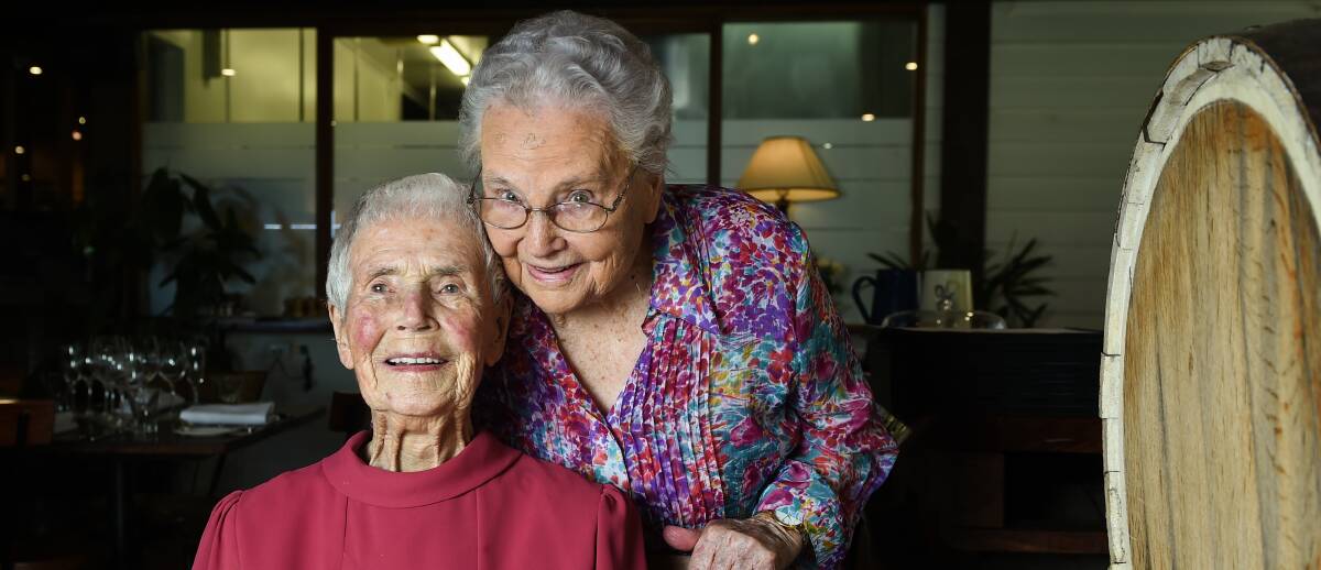 OLD FRIENDS: Eileen Emery, 100, with her bridesmaid Gladys Crawford, 90, of Corowa, who celebrated together at Brown Brothers Estate.