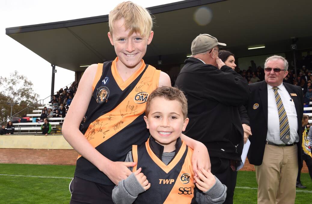 CLUB COLOURS: Jack Hodgson, 11, and Tyler Cross, 5, get out in their jerseys to support the Tigers.