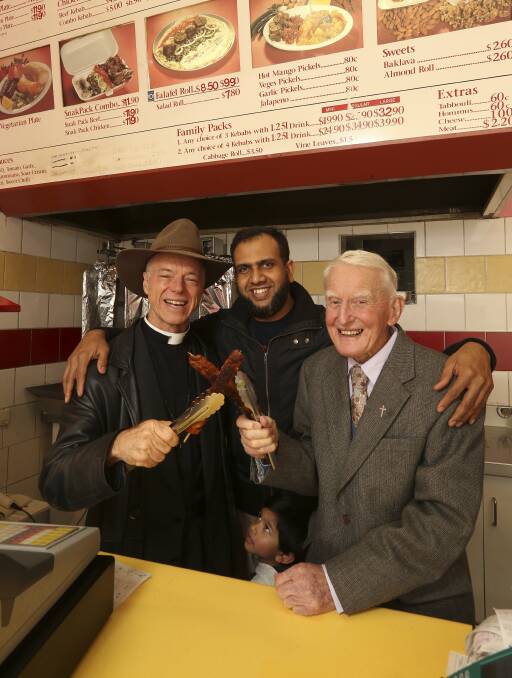 UNITY: Father MacLeod-Miller, Kwik Kebab owner Hamidur Rahman and his 3-year-old son Farhan with Father Kevin Flanagan. Picture: ELENOR TEDENBORG