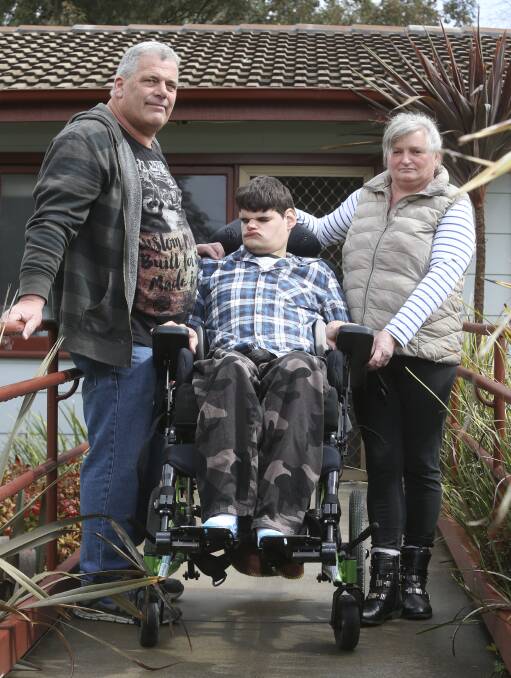 FUNDRAISER: John Hall and Mary Allum with their son Dillon, 24, who needs an accessible vehicle so he can get back on the move. Picture: ELENOR TEDENBORG