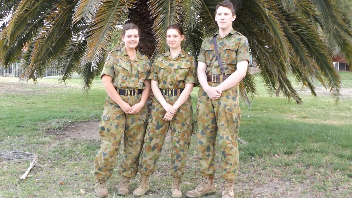 TRAINING: Army Cadets Debbi Barnes, 17 and Tahlia Blom, 16 and Sam Walsh, 18, in uniform.