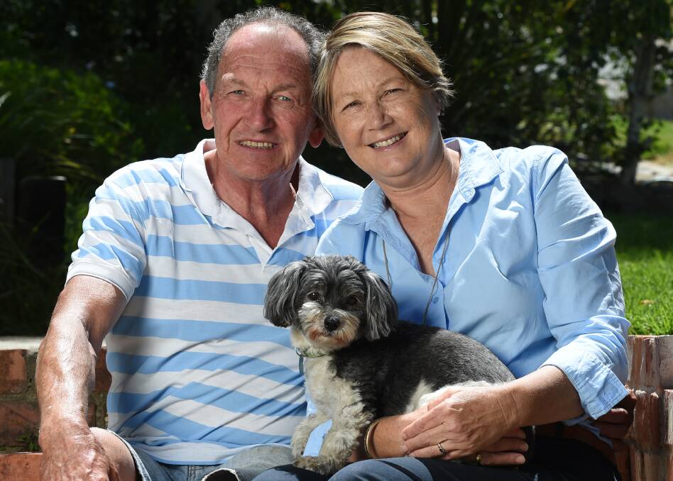 MIRACLE: Georgie the dog sits with Brian Elliott and his wife Sue who are encouraging families to discuss organ donation. Picture: MARK JESSER