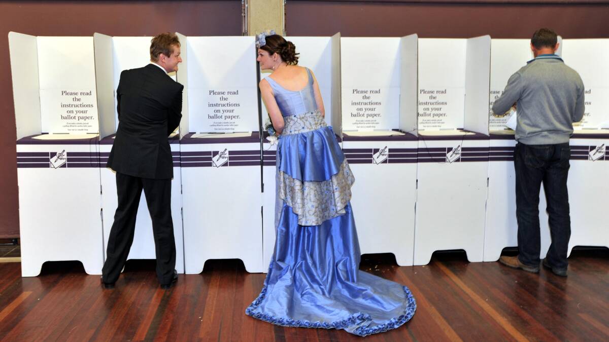 Carherine Harvie and Adam Warren cast their vote at South Wagga Public school in 2013 after a clash of daters with their wedding. Wagga voters will head to the polls on September 8, 2018 for the state byelection.
