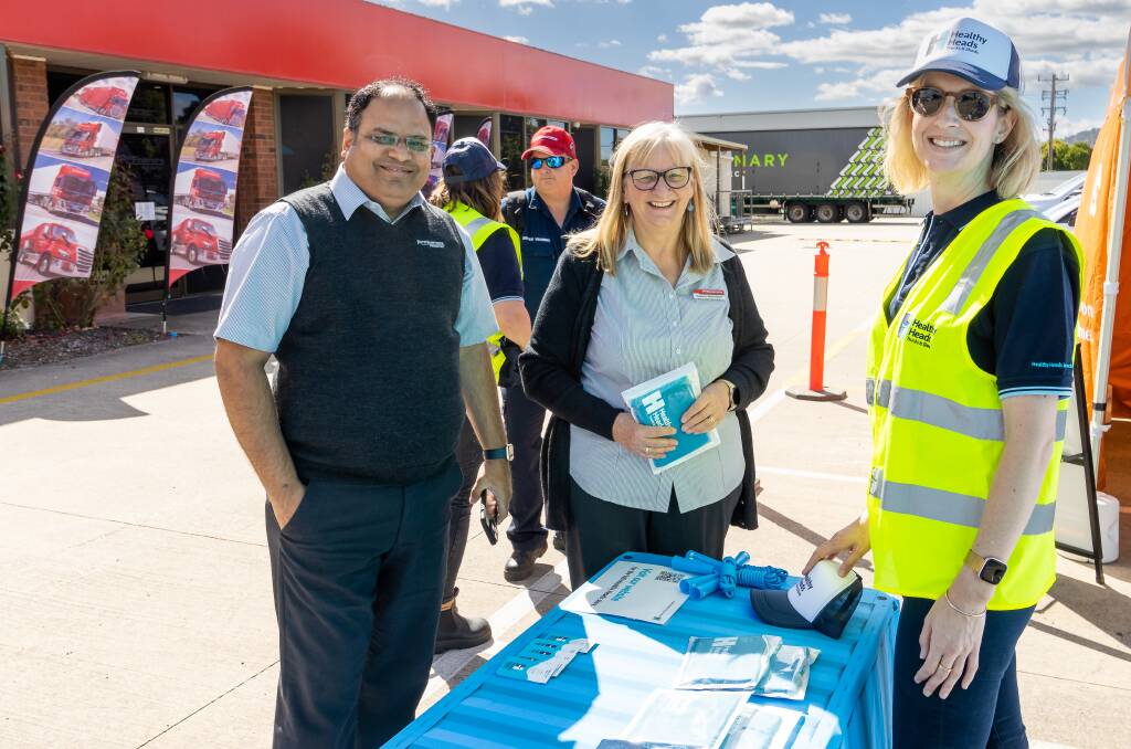 Ron Finemore Transport staff Dhaval (left) and Val with Healthy Heads in Trucks & Sheds CEO Naomi Frauenfelder (right) at the Wodonga depot. Picture supplied 