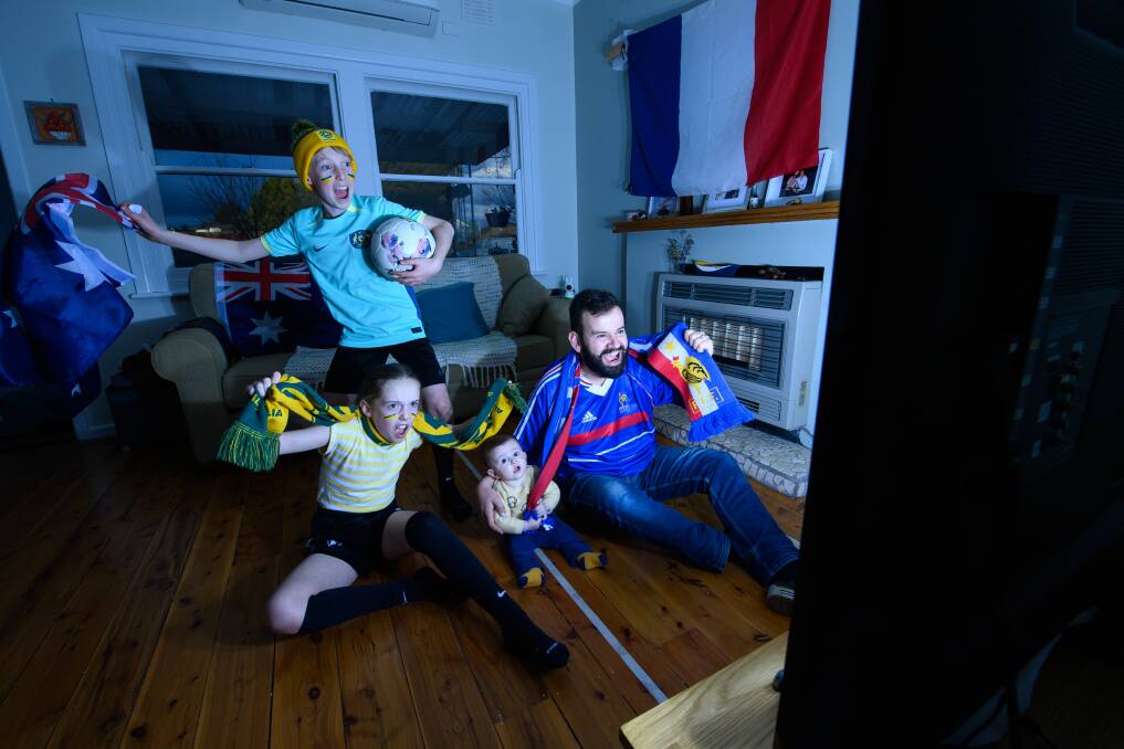 Albury Frenchman Sylvain Vergos, with his son Mathis, five months, who has a foot in both camps, and Australian family friends Evie, 9 and Moss Roseby, 10, are excited for the FIFA Women's World Cup quarter final between Australia and France on Saturday, August 12. Picture by Mark Jesser