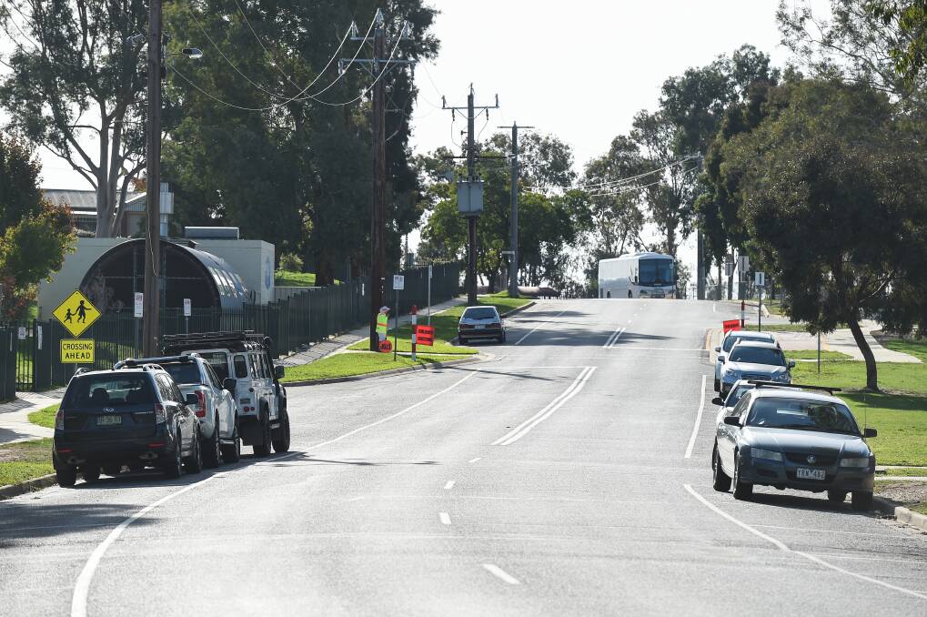 UNUSUALLY QUIET: At pick-up time on Wednesday afternoon outside Wodonga's Melrose Primary School, there was no trouble finding a car parking space on day one of remote learning for Victoria students. Picture: MARK JESSER