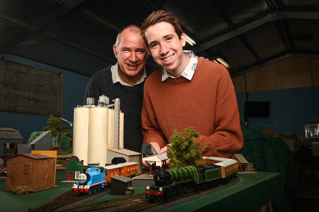 ON TRACK: Martin Fraser, 16, with his father, Peter, who will be exhibiting their display for the first time at the annual Murray Railway Modellers show. Picture: MARK JESSER