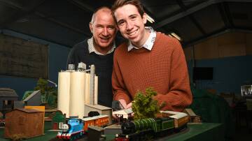 ON TRACK: Martin Fraser, 16, with his father, Peter, who will be exhibiting their display for the first time at the annual Murray Railway Modellers show. Picture: MARK JESSER