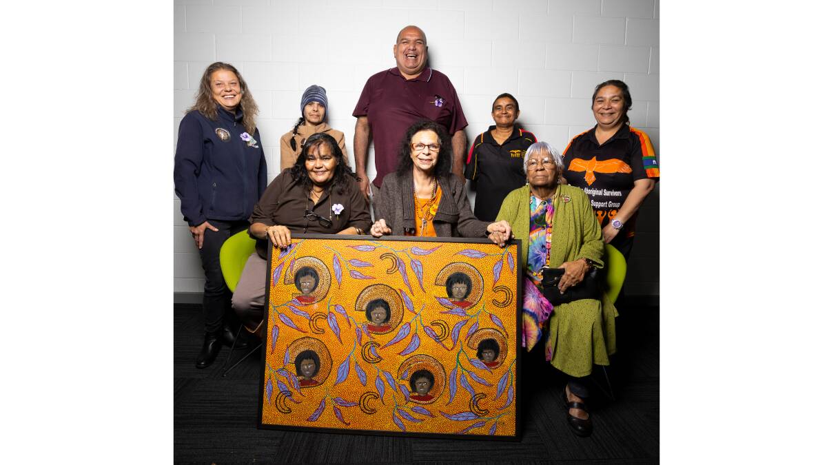 UNITY: Back Row: Ruth Davys, Melanie Kennedy, Aaron Perkins-Kemp-Berger, Donna Thomas and Alice Maher. Front Row: Alison Reid, Elder Aunty Betty Hood, Rita Wenberg holding a painting of Rita Wenberg's lost sisters. Picture: ASH SMITH
