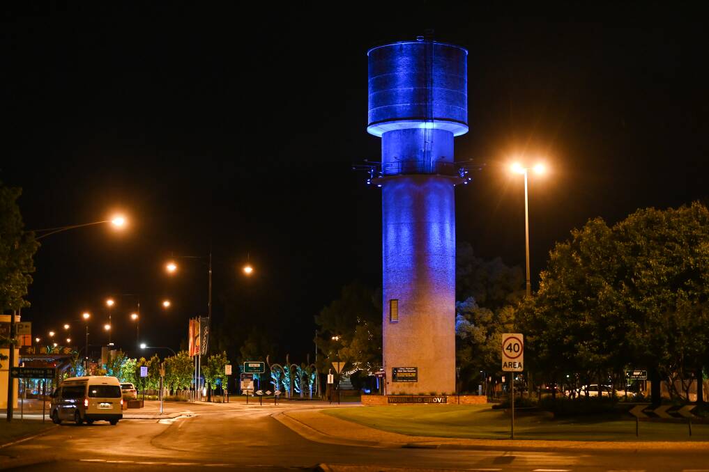 SHINE A LIGHT: Wodonga's Water Tower was beaming with blue across the weekend in support of Huntington's Disease awareness. Picture: MARK JESSER
