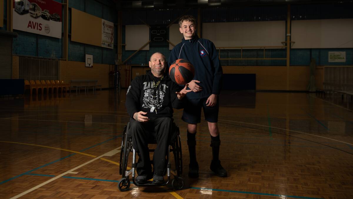 Michael Gray and his son Jackson play representative wheelchair basketball together. Picture by Tara Trewhella