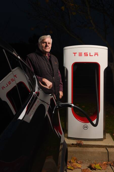 Klaus Wolki charges his Tesla Model X at the Wodonga Supercharger. 