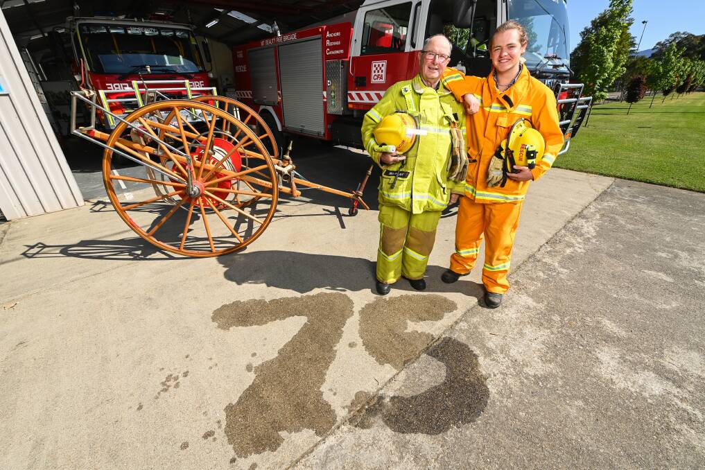 Mount Beauty CFA life member Paul Macklan and one of the brigade's youngest members Noah Tanzen are looking forward to the 75th anniversary celebrations on November 11 and 12. Picture by Mark Jesser