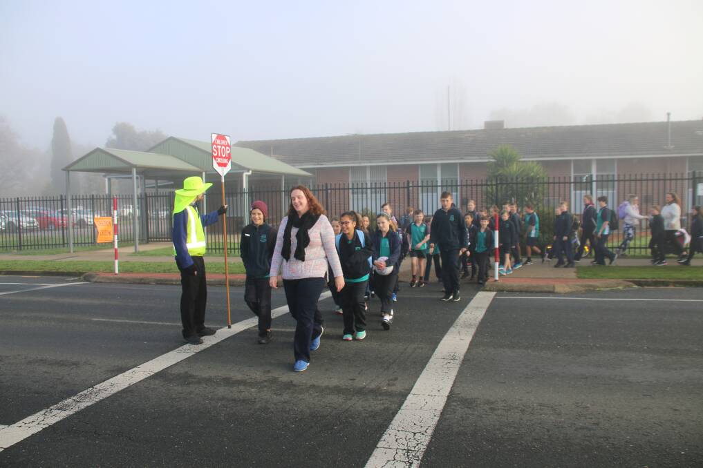 SAFETY FIRST: Lavington Public School teachers and students safely cross the road at the launch of the campaign on Tuesday. Picture: ALBURYCITY