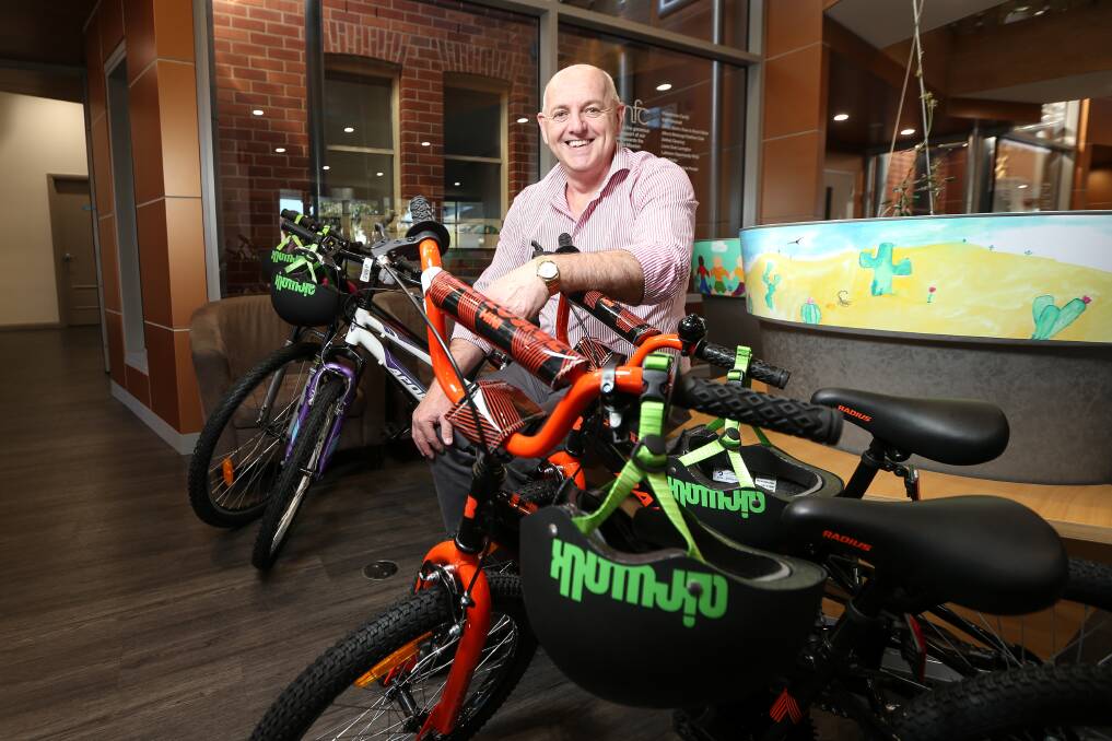 WELCOME DONATION: Upper Murray Family Care chief executive Luke Rumbold with some of the bikes donated from a team building exercise. Picture: JAMES WILTSHIRE